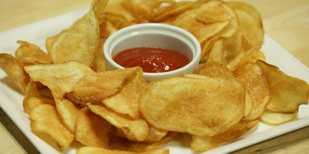 Pub Chips with Spicy Ketchup Spicy Ketchup 14 fl. oz. ketchup 4 fl. oz. Frank s Wing Sauce 1 tsp. granulated garlic Pub Chips 2 lb. frozen potato chips 1 tbsp.