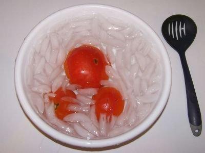 .. Plunge them into a waiting bowl of ice water. This makes the skins slide right off of the tomatoes!