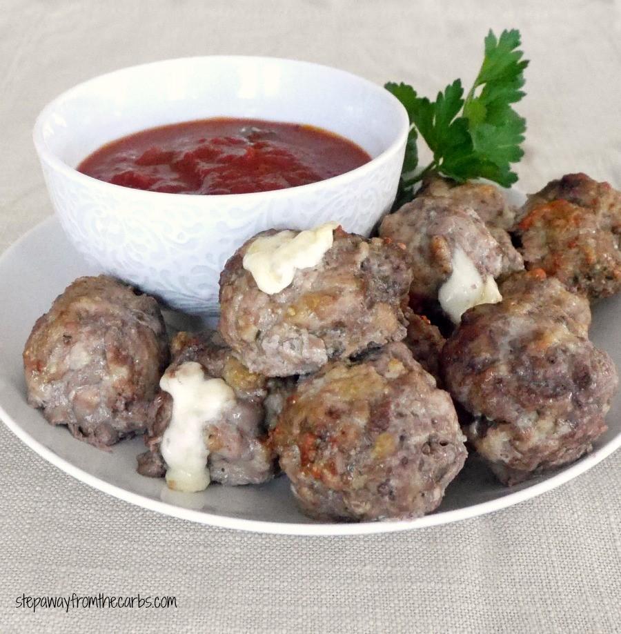CHEESE STUFFED MEATBALLS Serves 6 10 oz ground pork 20 oz ground beef 2 large eggs ¼ cup grated Parmesan 1 tbs Italian seasoning salt and pepper 3 cheese string sticks, cut into small pieces Preheat