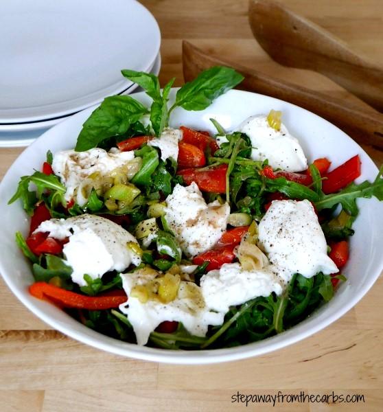 ROASTED RED PEPPER AND MOZZARELLA SALAD Serves 4 2 red bell peppers (halved, seeds and stalk removed) 2 cups arugula 5-6 fresh basil leaves (torn) 1 ball buffalo mozzarella 2 tbs olive oil (divided)