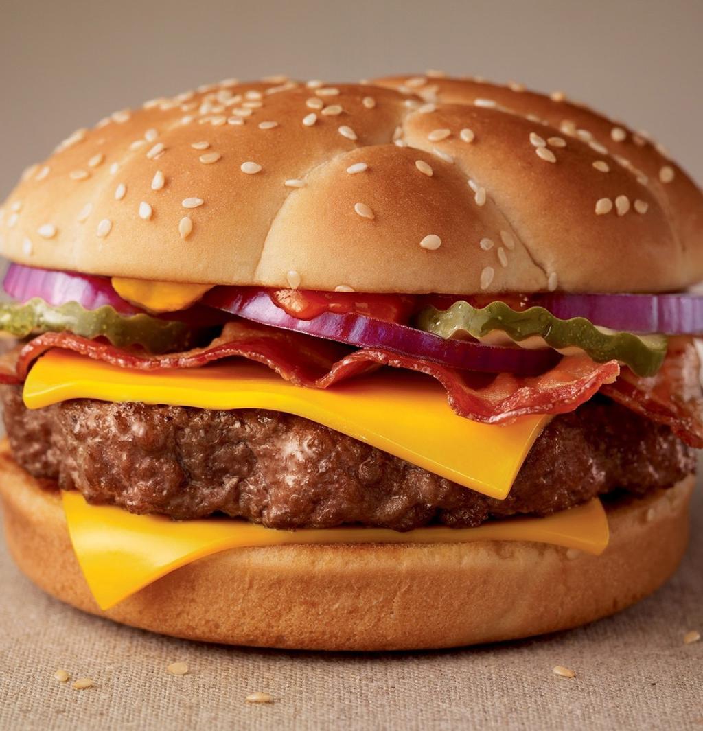 cut fruit salad. HAMBURGER...7.49 Half pound fresh beef patty served with lettuce, tomato and pickles on a fresh sesame seed roll. CHEESEBURGER...7.99 Half pound fresh beef patty served with lettuce, tomato and pickles topped with cheddar cheese on a fresh sesame seed roll.