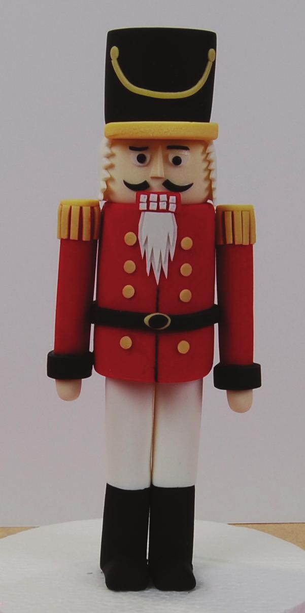 To spice up your holiday table insert your completed nutcracker into a festive center piece as shown on page 68.