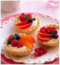 FRESH FRUIT TARTLETS 200g plain flour 100g butter 50g caster sugar 1 tin custard Fresh fruit Make the pastry by rubbing the butter into the flour Add the caster sugar Add 3-4 tblspns cold water mix