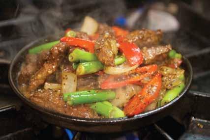 SIZZLING BEEF $23 Sizzling marinated wagyu beef, onion, capsicum, shallot in garlic and