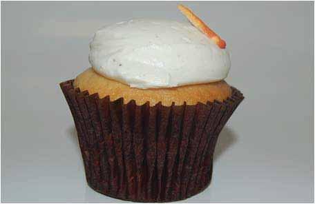 The cupcake icing should be gently rolled in the crumbs, without pressing the icing into the crumbs.