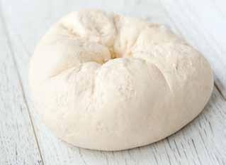 Using a smaller bowl makes it easier to see when the dough has doubled in a large bowl this can be deceiving. Grease the loaf tin and pop in the shaped dough.