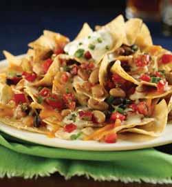 00 CLASSIC NACHOS (Big enough to share) Tortilla chips piled high and layered with three bean mix, Monterey Jack and