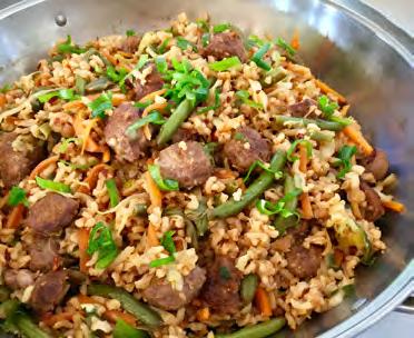 APPROX. 30 MINS NASI GORENG EACH SERVE GIVES: 1 1 2 Heat one tablespoon of oil in a large frying pan or wok over medium-high heat. Place the sausages in the pan and fry until they are cooked.