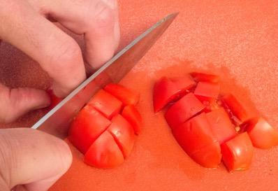 Cut the tomatoes in half lengthwise, cut each