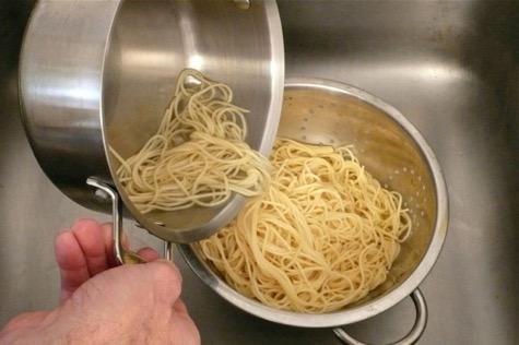 pour the pasta and hot water into