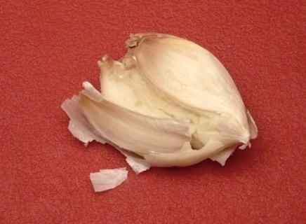 garlic clove open to make peeling the