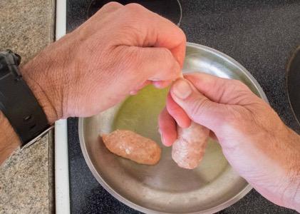 squeeze the sausage meat out of the sausage