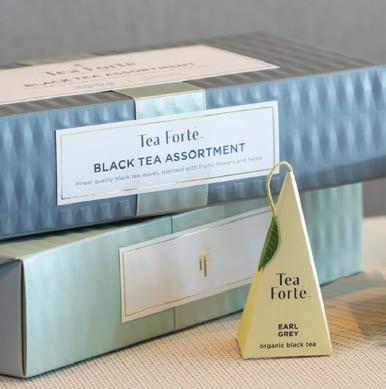 in a luxurious, gold foil lined wrapper, and detailed tea menu for easy blend