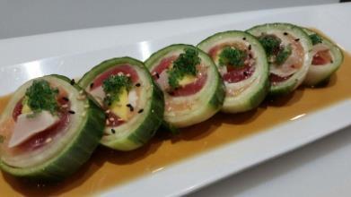 sesame dressing, chili oil, and special ponzu sauce Hulk $12 Assorted fish, wasabikko, mango, and avocado; wrapped with cucumber and yuzu ponzu sauce on top