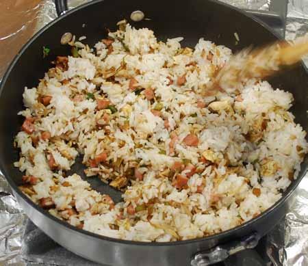 7 5 Add the cooked rice to the vegetable mixture and stir to blend well.