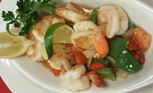 95 Butterfly Shrimps sautéed with peppers, onions, garlic and tomatoes in butter.