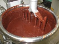 Cocoa mass + Sugar, milk ingredients, flavours Mixing of the ingredients