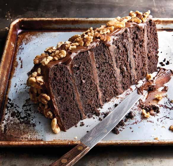 99 CHOCOLATE MOTHERLODE CAKE Six decadent layers of chocolate cake and rich chocolate fudge icing, topped with walnuts.