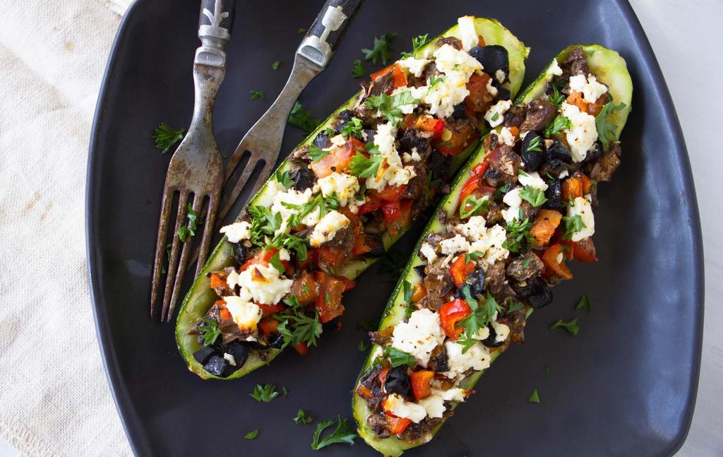 06 Mediterranean Mushroom-Zucchini Boats SERVES 6 : 3 small zucchinis, halved 1 small tomato, finely diced ¼ cup red bell pepper, finely diced 1 ½ cups baby bella mushrooms, chopped 2 tablespoons