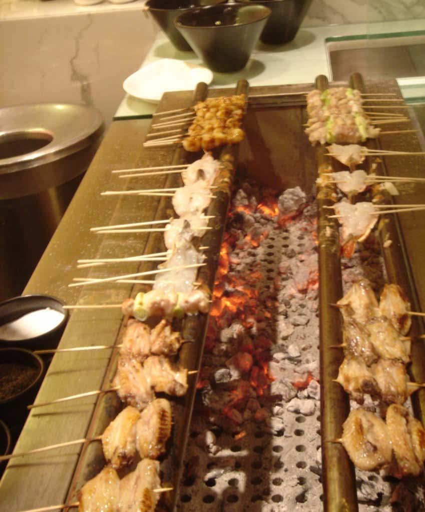 Specialty Grill - ROBATA Traditional Japanese grill Oberoi New Delhi Rectangular Bars lie above the charcoal or gas tray/box Place food