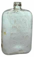 152 mm. A rare little flask which is quite early, around 1900s. Shepparton Co-operative Society Ltd, CO-OP TM. Clear. 283 mm.