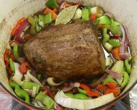 12 Add the Worcestershire sauce, beef stock, (and optional soy sauce), then nestle the beef in the
