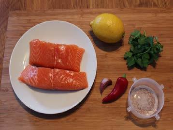 Place the other 2 wedges on the tray. Gently wrap the foil around the salmon and seal into a parcel.