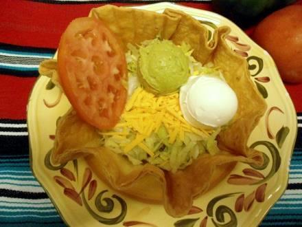 99 Flour tortillas stuffed with choice of filling above and cheese, served with tomatoes, sour cream, and lettuce QUESADILLA