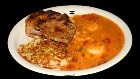 Steak & Eggs* $9.75 Served with hash browns, and smothered in green chile with a choice of toast or tortillas. Pork Chop & Eggs* $9.