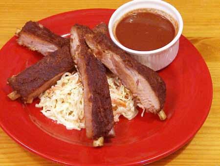 9 Divide the ribs into desired portions and serve with plenty of coleslaw and some additional sauce on the side.