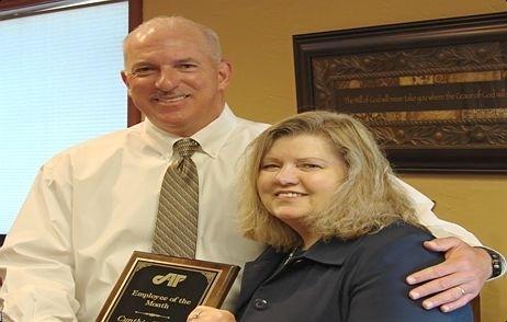 Randy Arceneaux, President and CEO presents the Employee of the Month award to Cindy Turner