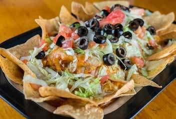 SOUTH OF THE BORDER Taco Salad 9.99 A house-made tortilla bowl filled with crisp lettuce, tomatoes, onions, cheese, beans, and black olives.