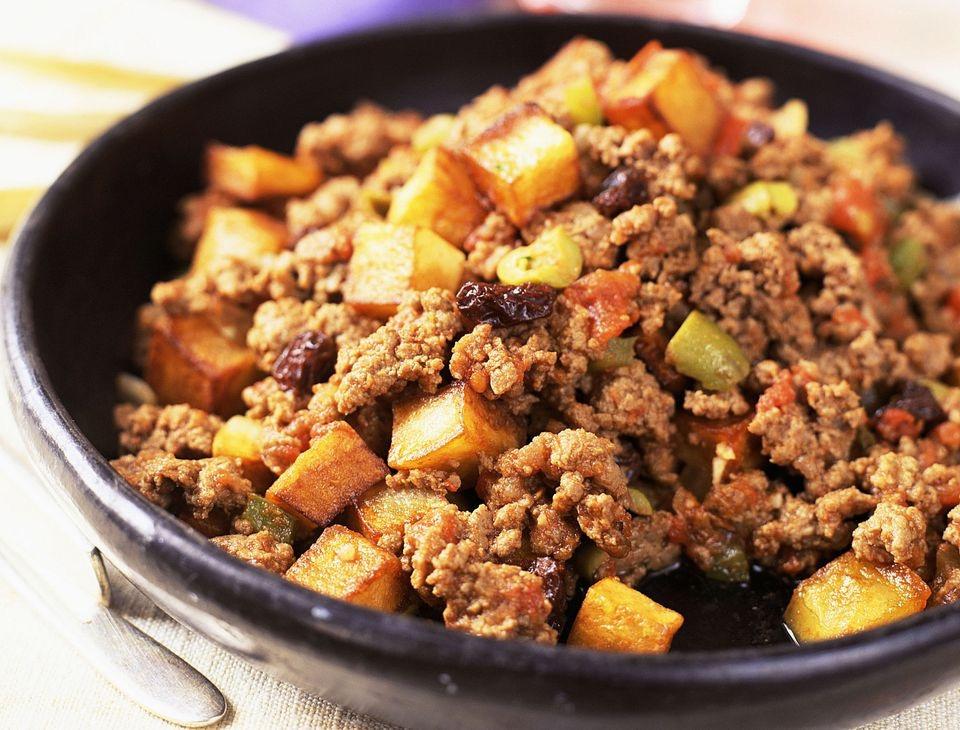 PICADILLO Mexico 1 1/2 cups beef 1 cup potato, peeled and diced into 1/2inch cubes 1/4 onion, diced fine 1/4 tomato, diced fine 1 tablespoon grated garlic 2 tablespoons oil 1/2 teaspoon salt 1/4