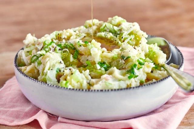 COLCANNON Ireland 2 cups potato cubes 4 tablespoons unsalted butter 1/4 cup 2% cream 2 cups shredded lettuce or kale 1 cup of kale ribs removed and sliced thin 3 scallions finely chopped 3/4 teaspoon
