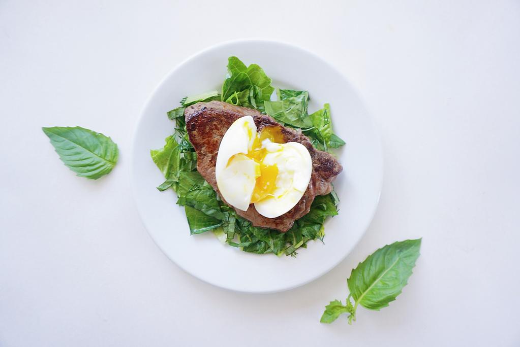Steak and Egg Ingredients 1 teaspoon coconut oil 6 oz filet minion steak 1 egg 2 Basil leaves julienned 1 Fennel frond chopped 1/4 cup of Romaine lettuce chopped Instructions 1.
