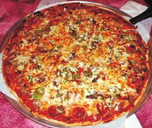 com Our Specialty Pizzas Super King This monster of a pizza comes with Green Peppers, Onions, Mushrooms, Pepperoni, Sausage, Hamburger, Baked