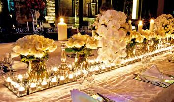 tea light votives on white pressed linen Professional tied satin or organza sashes on elegant pewter chairs DJ for reception Rose petals for ceremony walkway Red carpet for garden aisle walkway