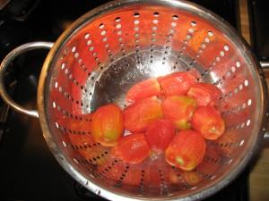 If not, then continue to boil another 2 mins. Remove tomatoes 2-3 at a time using a slotted spoon into a colander.