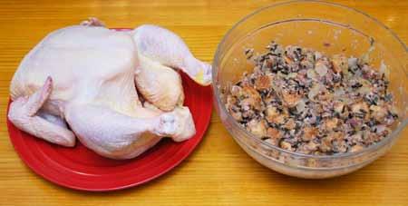 14 If present, remove the neck and giblets from inside the chicken.