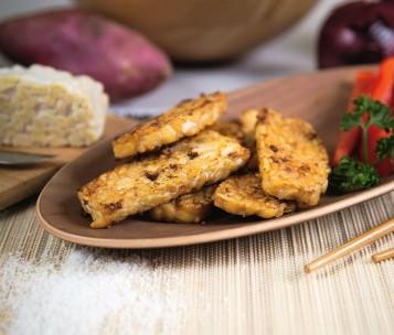 Tempeh Block Tempeh is a basic product, made from cooked and fermented soybeans. A block of Tempeh weighs 400 grams and is also deliverable in 200 grams.