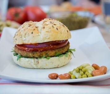 Bean Burger The Bean Burger is a deliciously spicy burger full of veggies that uses pea protein as a base. A bean burger weighs about 80 grams and contains no milk, egg or soya.