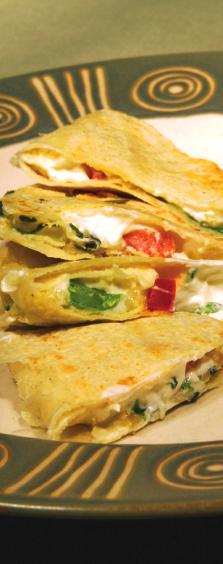 Colorful Quesadillas Serving Size: 4 wedges or one quesadilla Makes: 8 servings 8 ounces fat-free cream cheese 1/4 teaspoon garlic powder 8 small flour tortillas 1 cup chopped sweet red or green bell
