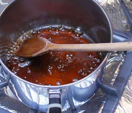 15 10 Combine the brown sugar, white sugar, and water in a saucepan over medium heat. Bring to a boil, stirring constantly, and reduce the heat to low.