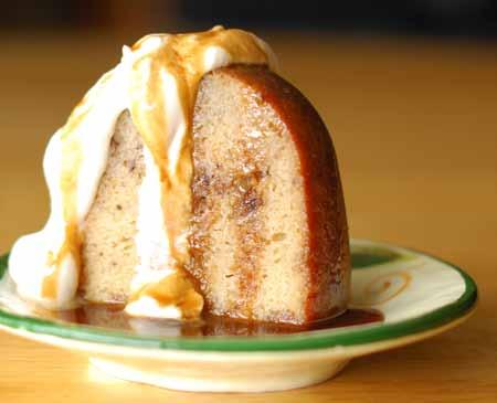 17 11 To serve, place a slice of cake on a serving dish. Spoon some of the cream on top, letting it drape down the sides.