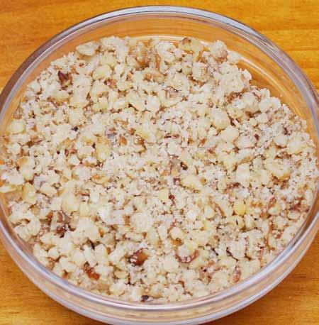 3 4 The crushed walnuts should resemble crumbs with a few larger pieces; no large chunks.