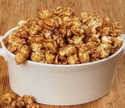 Delicious popcorn is covered in thick, creamy caramel.