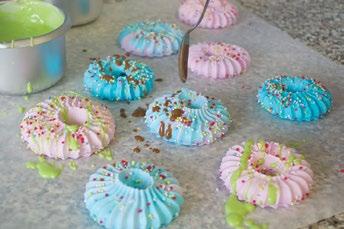 8 Decorate the meringues with drizzled chocolate,