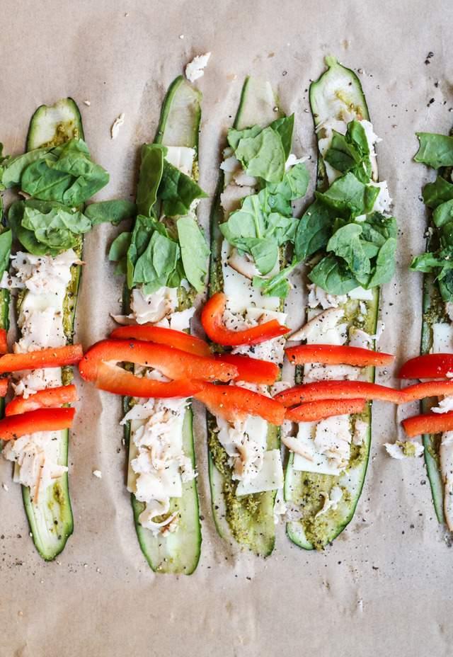 3 medium cucumbers (each will yield about 6 slices) ¼ cup store bought basil pesto 6 slices GO Veggie Lactose & Soy Free Mozzarella Slices, cut into ½ inch strips 6 oz deli