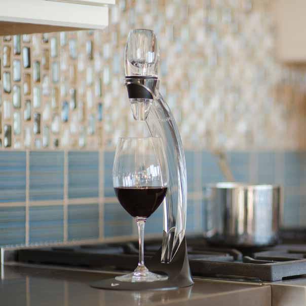 An elegant, curved tower holds the Vinturi Red Wine Aerator at the ideal height to pour red wine through it and into the glass,