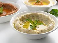Hommos With Meat & Pine Nuts Blend Of Chickpeas, Tahini, Fresh Lemon Juice With Sautéed Minced Meat & Pine Nuts.